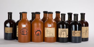 several bottles of wine are lined up in a row