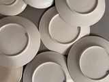 a lot of plates that are sitting on a table