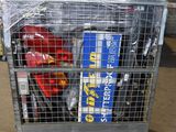 a metal cage filled with books and a red fire hydrant