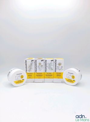 three boxes of sunflower cream sitting on top of each other