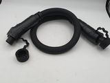 a close up of a black hose and a black hose on a white surface