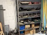 a man that is standing in a room with a lot of tools