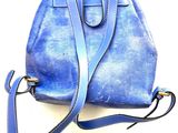 a small blue purse with a strap on it