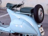 a scooter that is parked in a parking lot