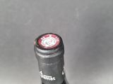 a close up of a bottle of wine on a table