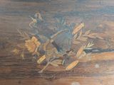 a wooden table with a bunch of flowers on it