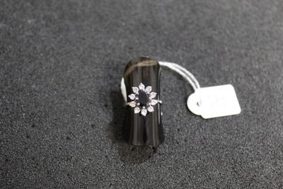 a ring with a flower on it sitting on a table