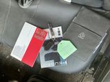 a car seat with a bunch of items on it