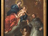 une image représentant un tableau sur lequel figure un homme tenant un enfant dans ses bras