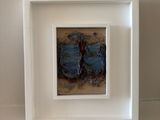 a picture of a picture in a white frame on the wall