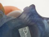 a close up of a blue vase with a tag on it