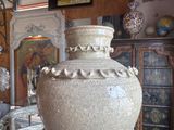 a large vase that is sitting on a table in a room