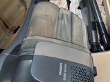 a box of vacuum cleaners and other items in a room