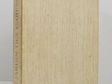 a book sitting on top of a table next to a white wall