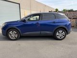 the blue suv is parked in front of a building