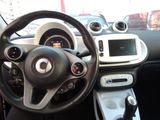 a steering wheel and dashboard of a small car