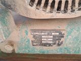 a close up view of a dirty machine with a label on it