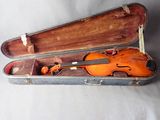a violin in a case with a bow in it