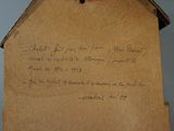 a piece of paper with writing on it sitting on a table