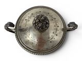 an antique silver plate with a lion head on it