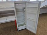 an open refrigerator that is sitting on the floor