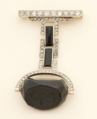 an image of a black and white stone and diamond broochle