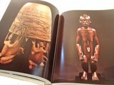 a book with a picture of a statue and a picture of a man