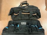 two bags that are sitting on the floor next to each other