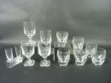 a lot of glasses that are sitting on a table