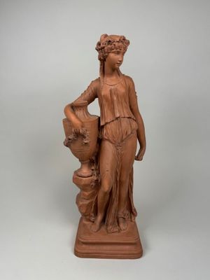 an image of a statue of a woman holding a vase
