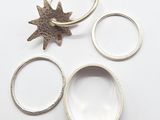 three rings and a ring with a star on top of them