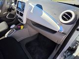 the interior of a car with a steering wheel and dashboard controls