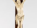 an image of a wooden cross with a statue of jesus on it