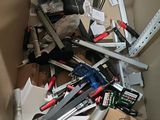 a box full of tools that are sitting on the floor