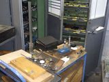 a picture of a workbench in a workshop with a lot of tools on it