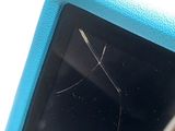 a small blue tablet with a broken screen on it