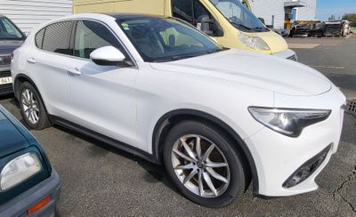 a white car that is parked in a parking lot