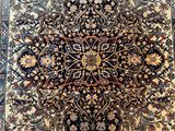 an antique persian rug with a medallion design on the center