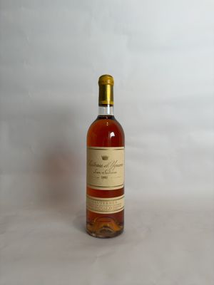 two bottles of wine sitting next to each other on a table
