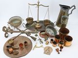an image of a collection of brass objects including a scale, a tray, and other items