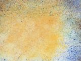 a close up of a blue and yellow plate on a wooden table