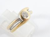 an image of a gold and silver ring with a diamond