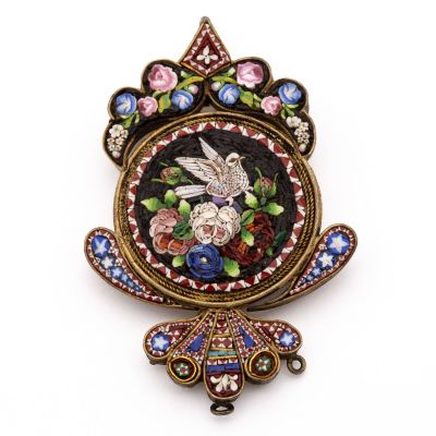 a picture of a brooch with a bird and flowers on it