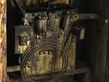 an old machine that is sitting in the corner of a room