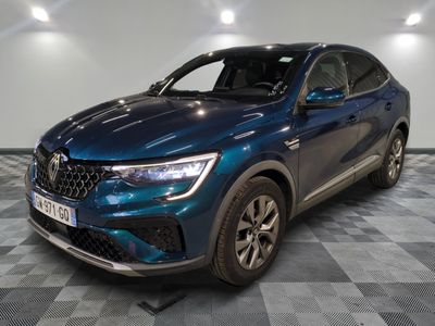 a blue suv parked in a garage with a checkered floor