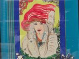 a picture of a woman with red hair in a picture frame