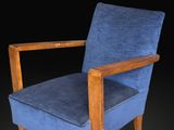 an image of a blue chair against a black background