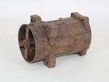 a small wooden barrel that is sitting on a white surface