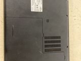 the back of a laptop with a sticker on the side of it