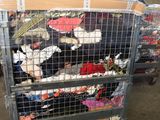a lot of shoes that are in a metal cart